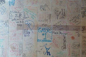 photo of ceiling tiles with writing on them